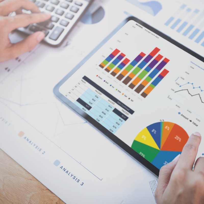 An expert in business valuation company analysing financial data charts on tablet